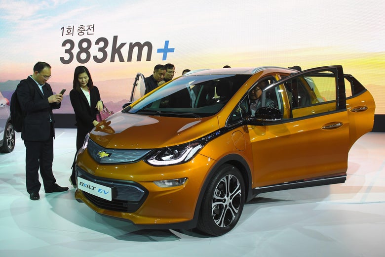 South Korean models pose with Chevrolet Bolt EV during a press preview of the Seoul Motor Show in Goyang, northwest of Seoul, on March 30, 2017.
South Korea's largest international auto show will open on March 31, with a total of 27 brands showing their latest cars and concepts.
/ AFP PHOTO / JUNG Yeon-Je (Photo credit should read JUNG YEON-JE/AFP/Getty Images)